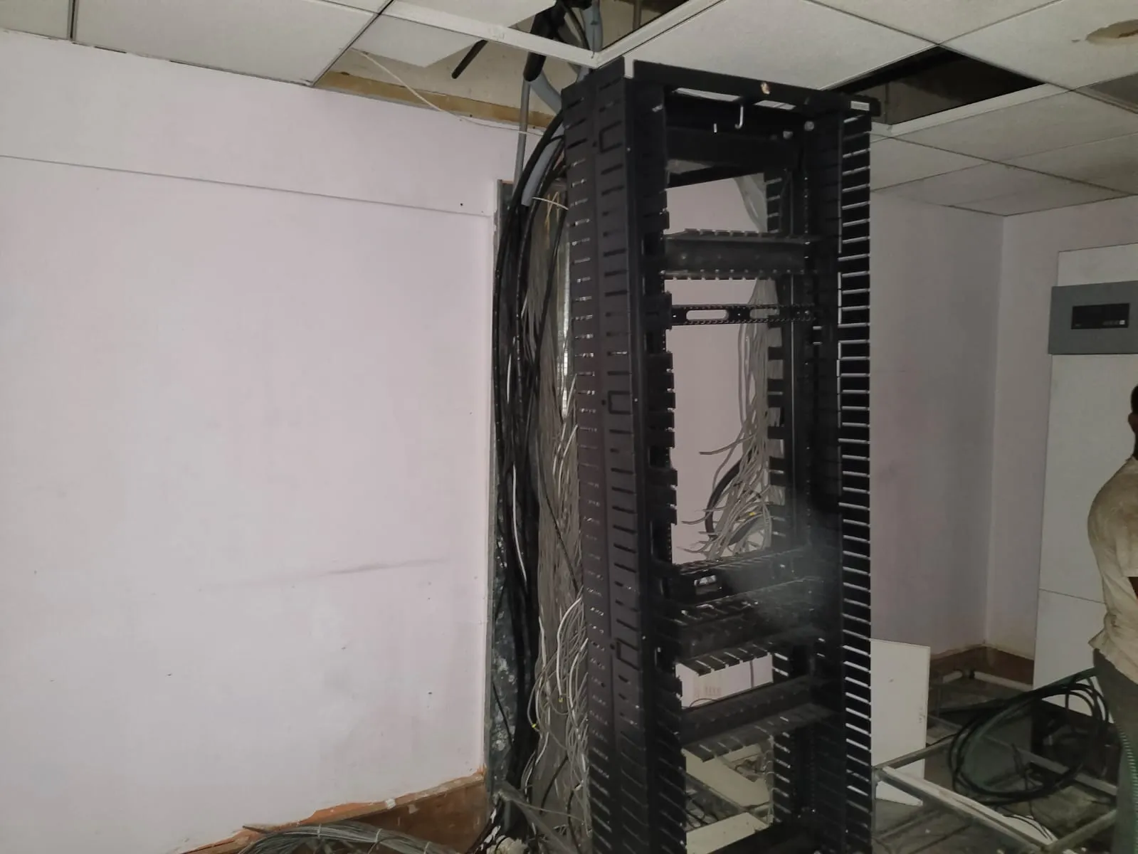 Wide interior view of a commercial office space restored to a bare shell layout during an office reinstatement service in Whitefield by Gravity E-Waste Management.